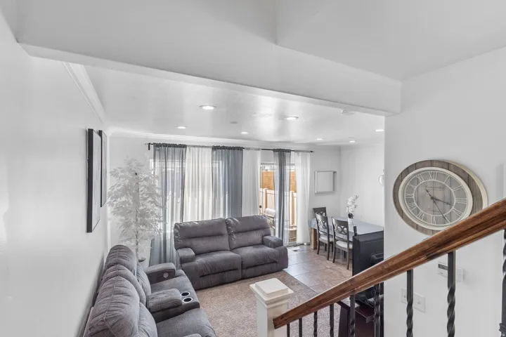 Tiled living area with recessed lighting