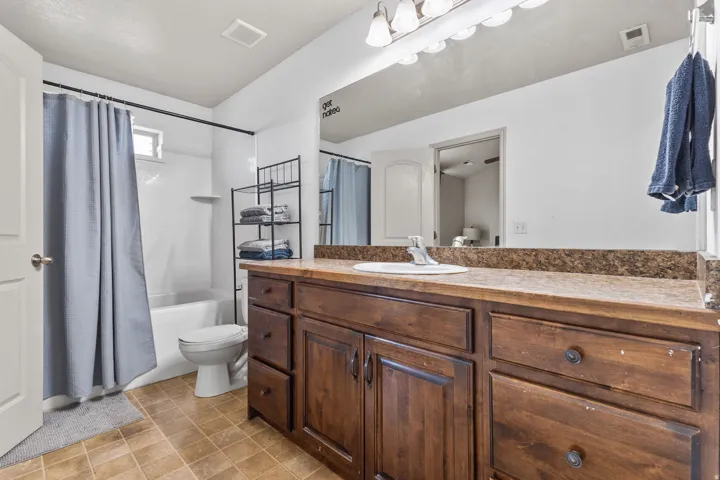 Full bathroom featuring vanity and shower / bath combo