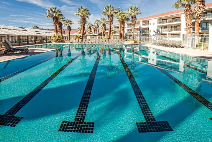 Community pool featuring a patio