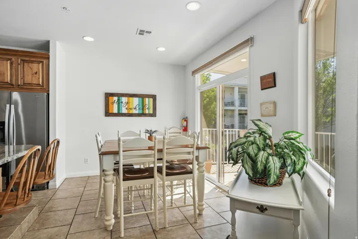 Dining area featuring recessed lighting and light tile patterned floors