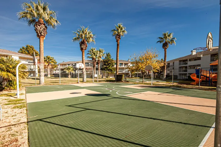 Surrounding community featuring community basketball court and a residential view