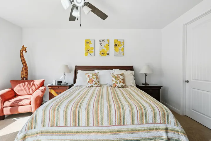 Bedroom featuring carpet floors and a ceiling fan