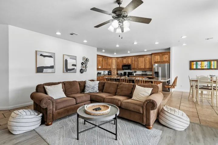 Living area with ceiling fan, recessed lighting, and light wood-type flooring