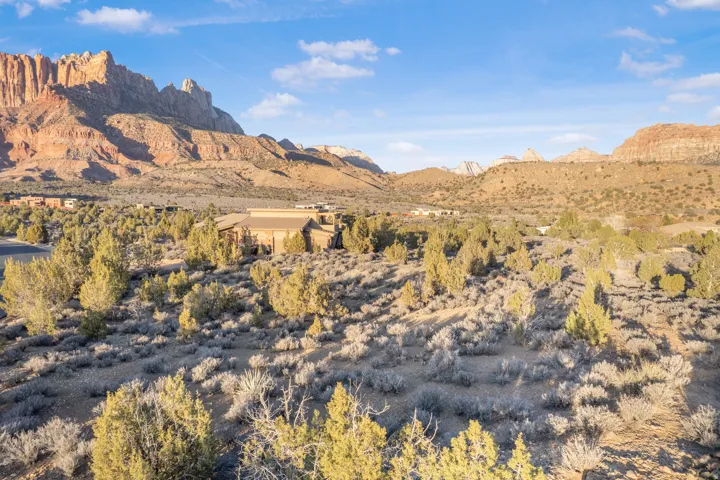 View of mountain backdrop featuring a desert landscape