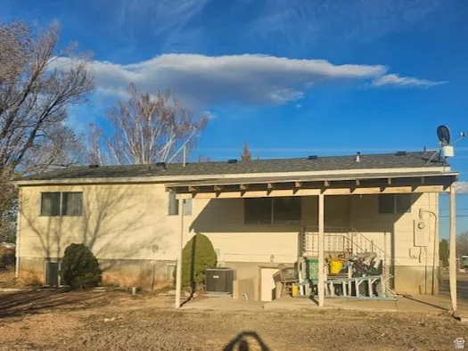 Rear view of house featuring a patio