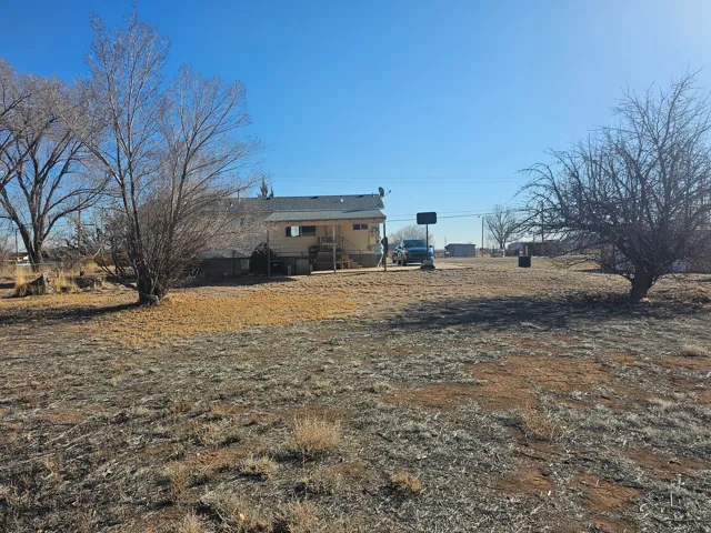 Rear view of house featuring a patio
