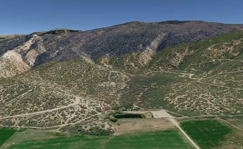 View of mountain backdrop featuring rural landscape