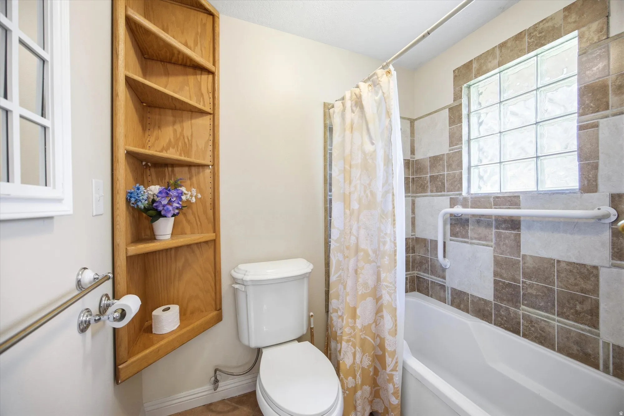 Full bath with shower / bath combo and toilet