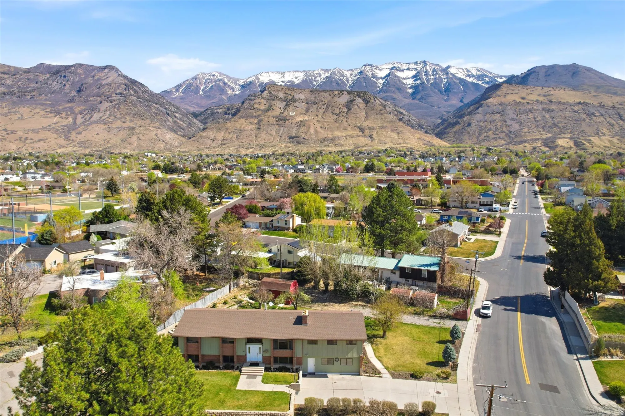 Aerial view of residential area featuring mountains