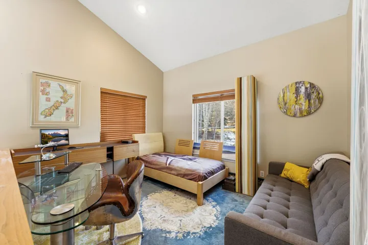Living area featuring lofted ceiling