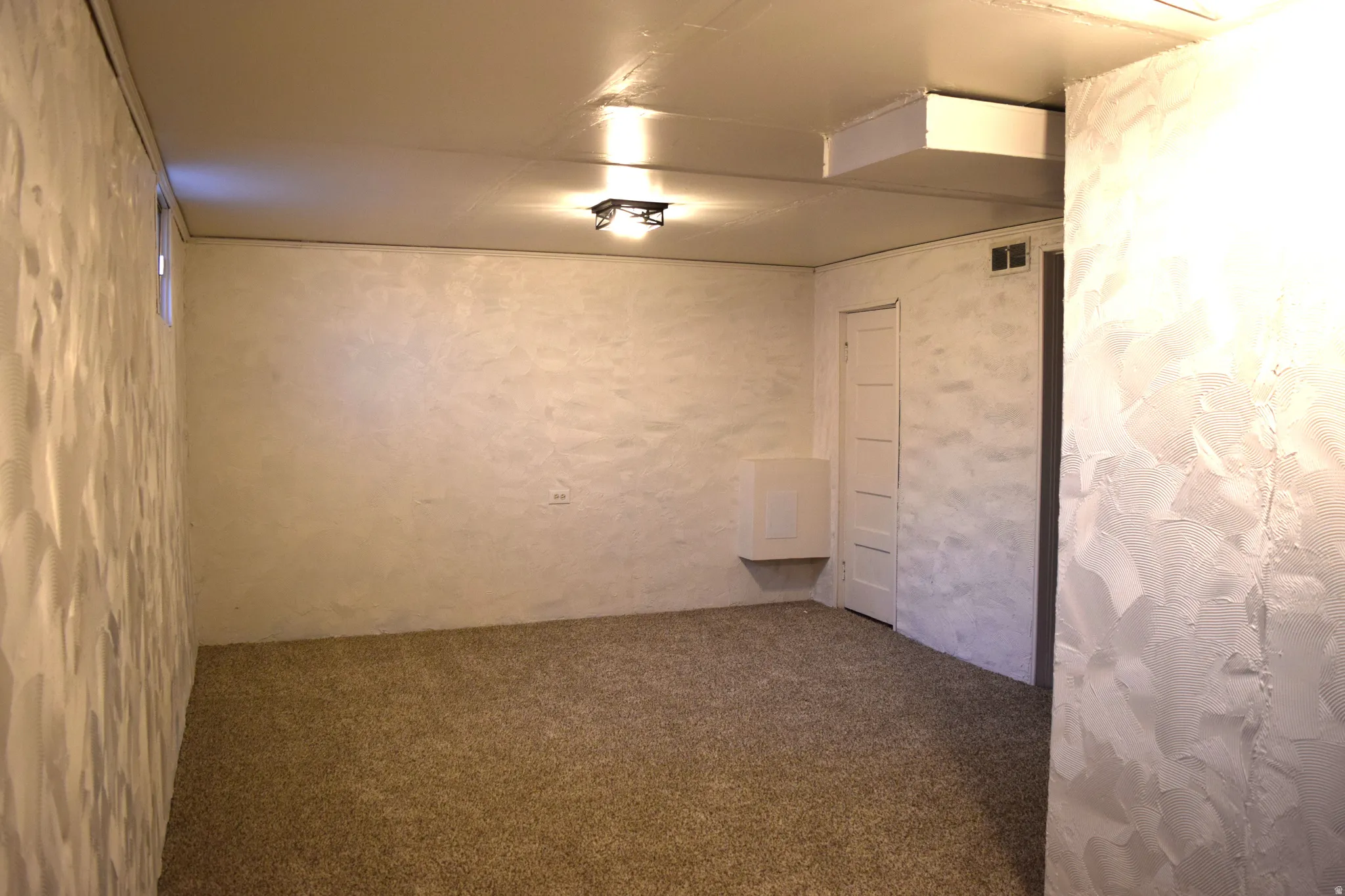 Basement featuring carpet flooring