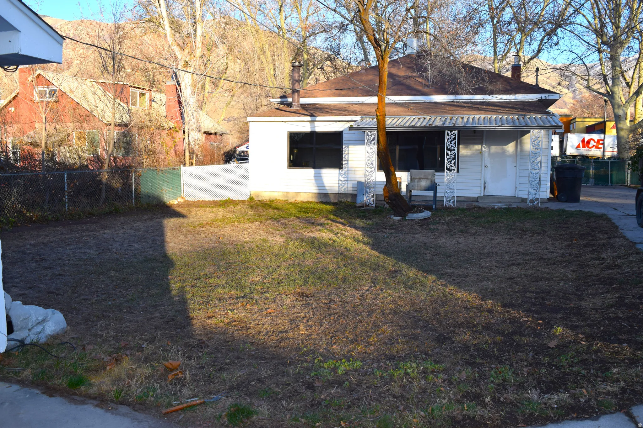 Rear view of property featuring covered porch and a chimney