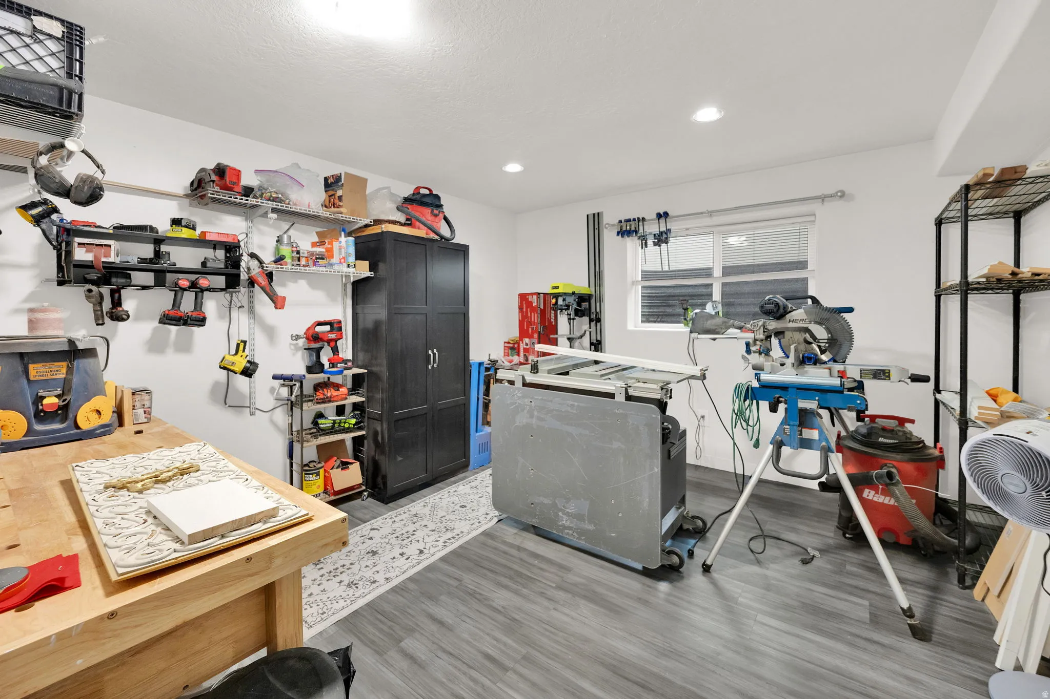 Kitchen with light wood finished floors and recessed lighting