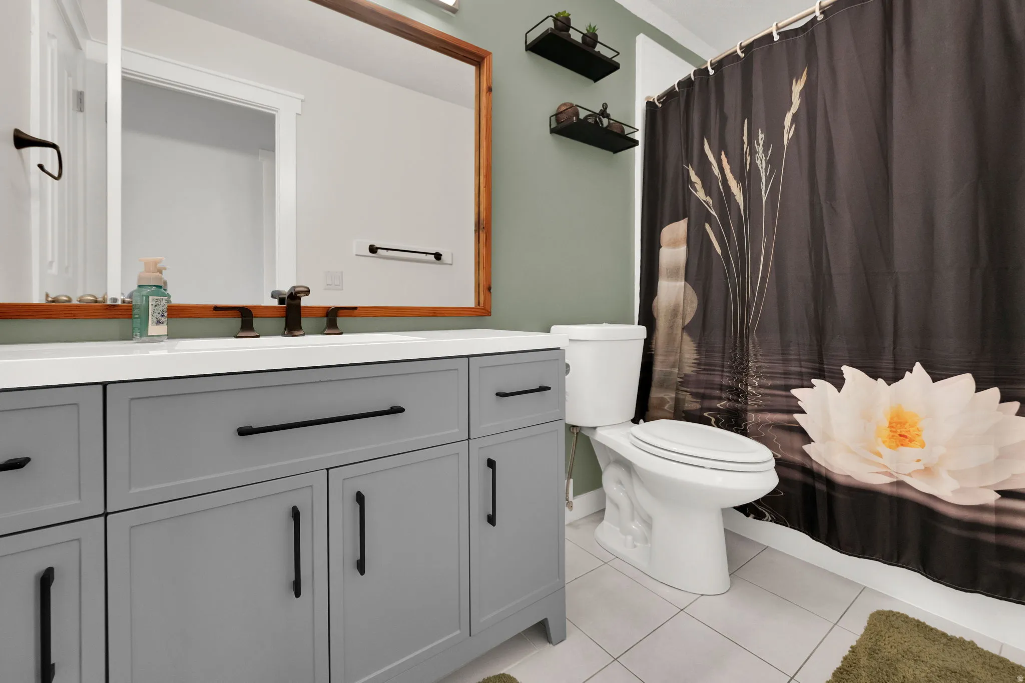 Full bathroom with vanity and light tile patterned floors