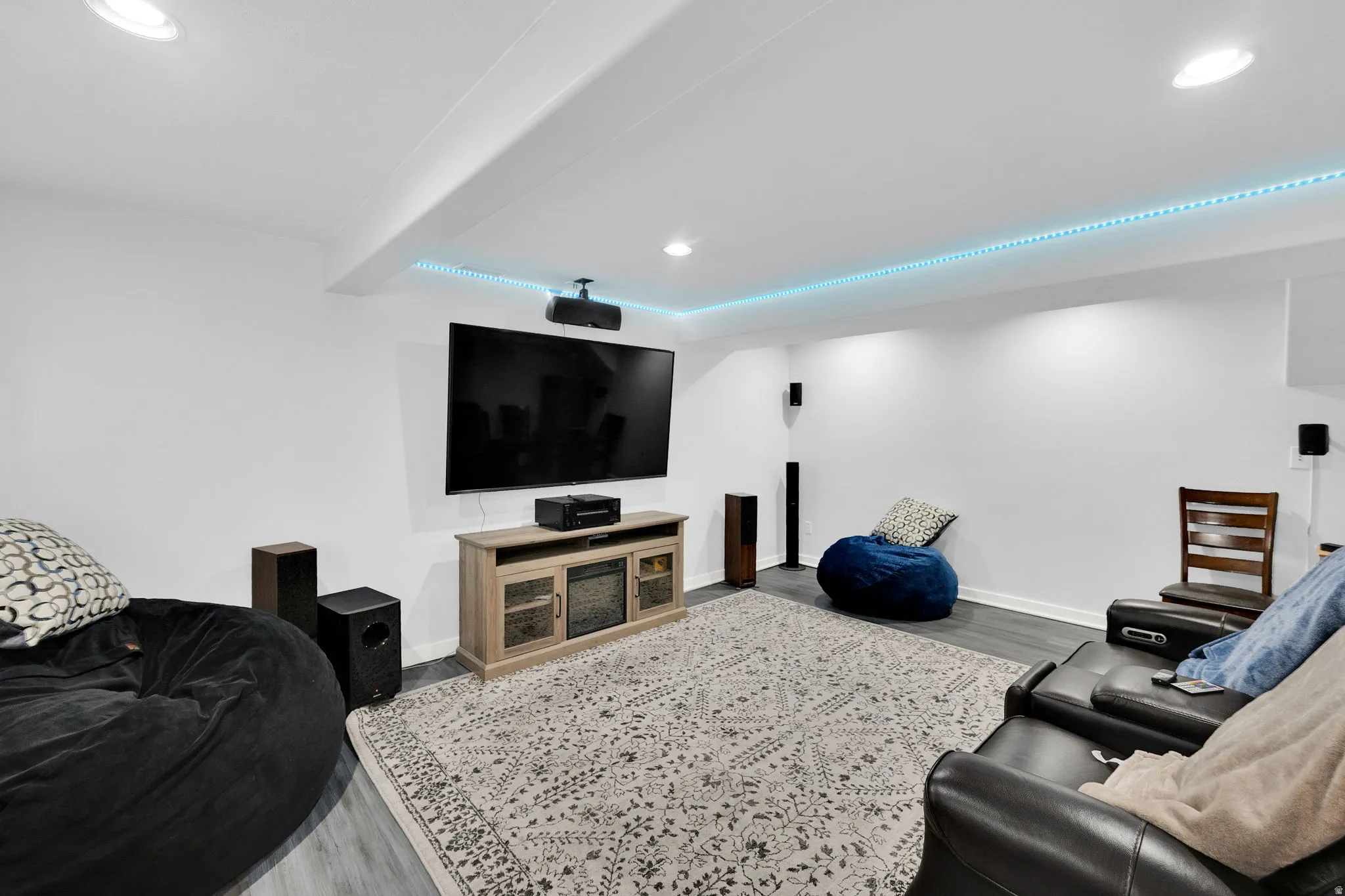 Living room with wood finished floors and recessed lighting