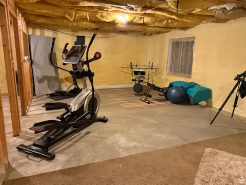 Workout room featuring concrete floors