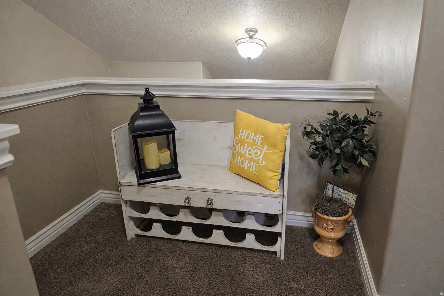 The top of the stairs nook is great for reading, storage, or your favorite decor.