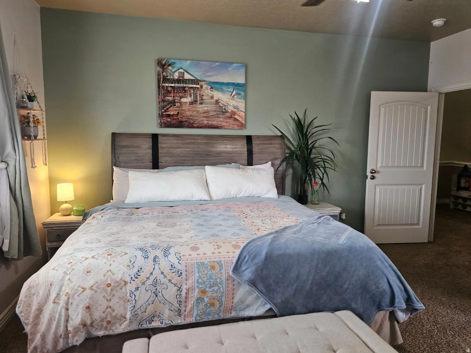 Bedroom featuring carpet floors and baseboards