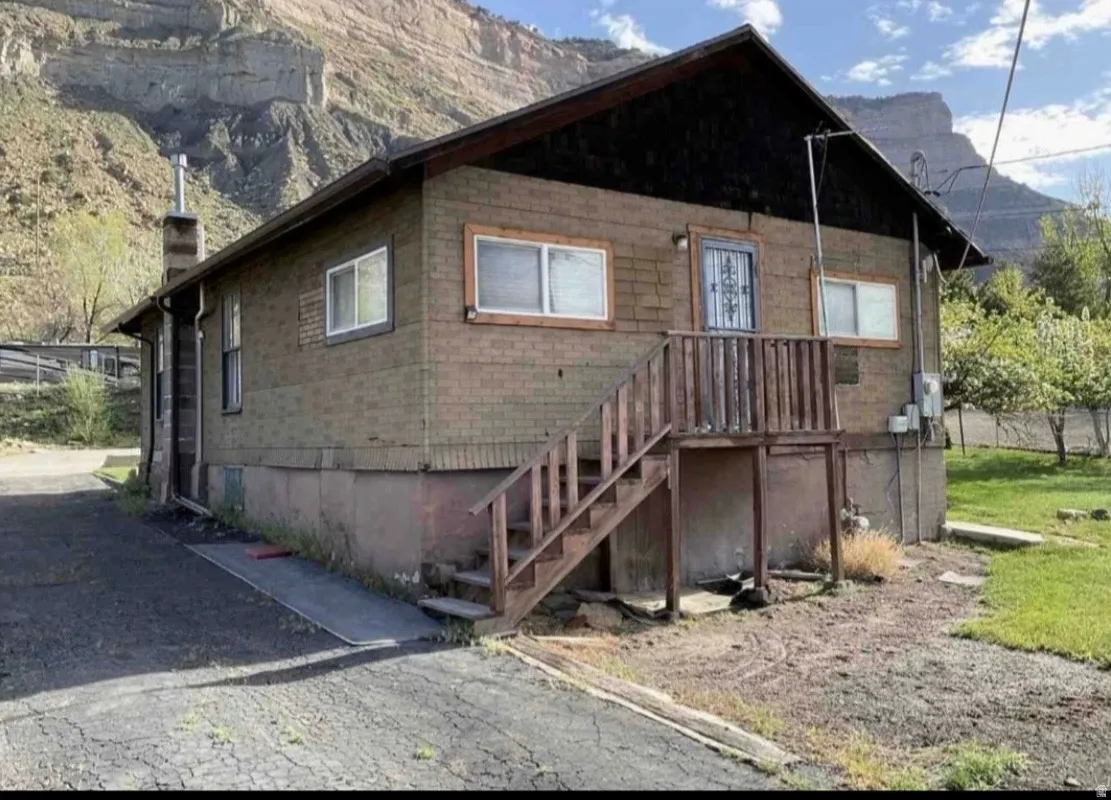 Photo of rear of home during Summer
