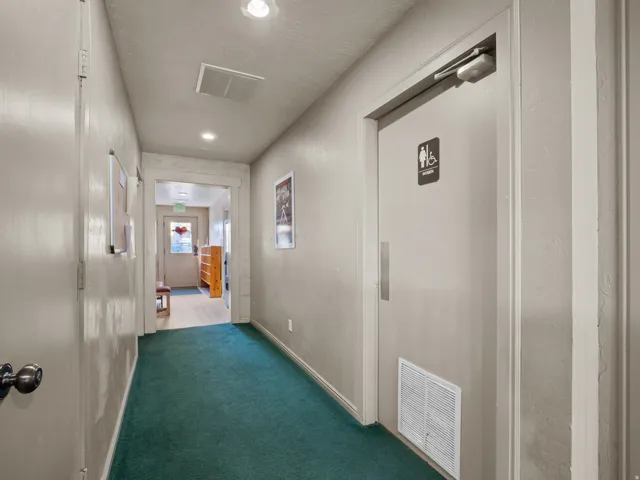 Corridor featuring recessed lighting and carpet floors