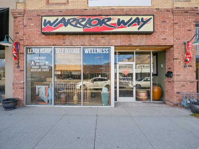 View of exterior entry with brick siding