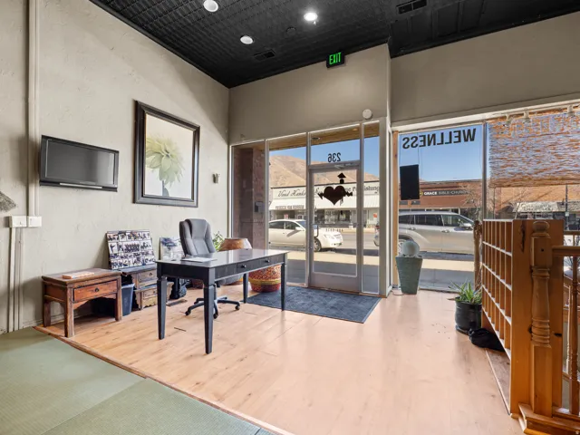 Office space with a textured wall and recessed lighting