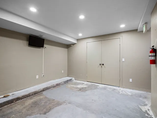 Finished basement featuring recessed lighting