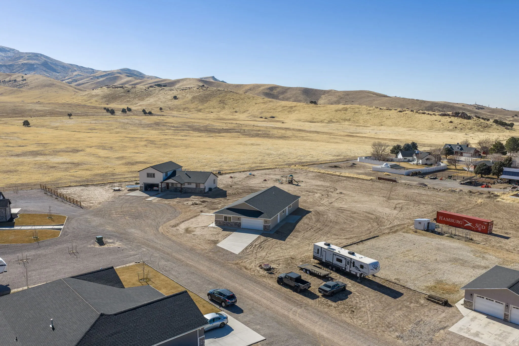 Aerial view of sparsely populated area with a mountain backdrop