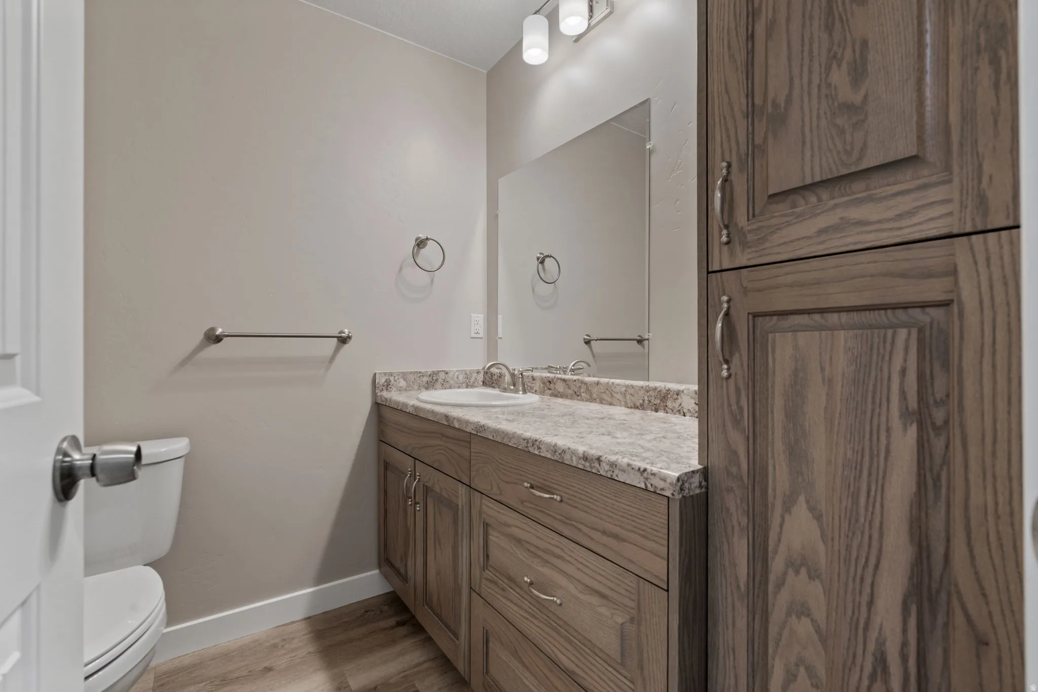 Bathroom featuring vanity and light wood-style flooring