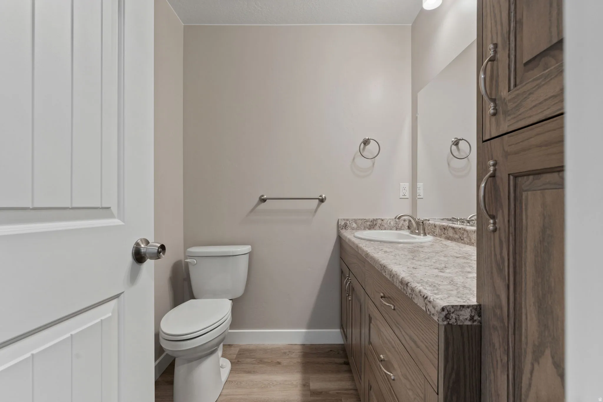 Bathroom with vanity and light wood-style flooring