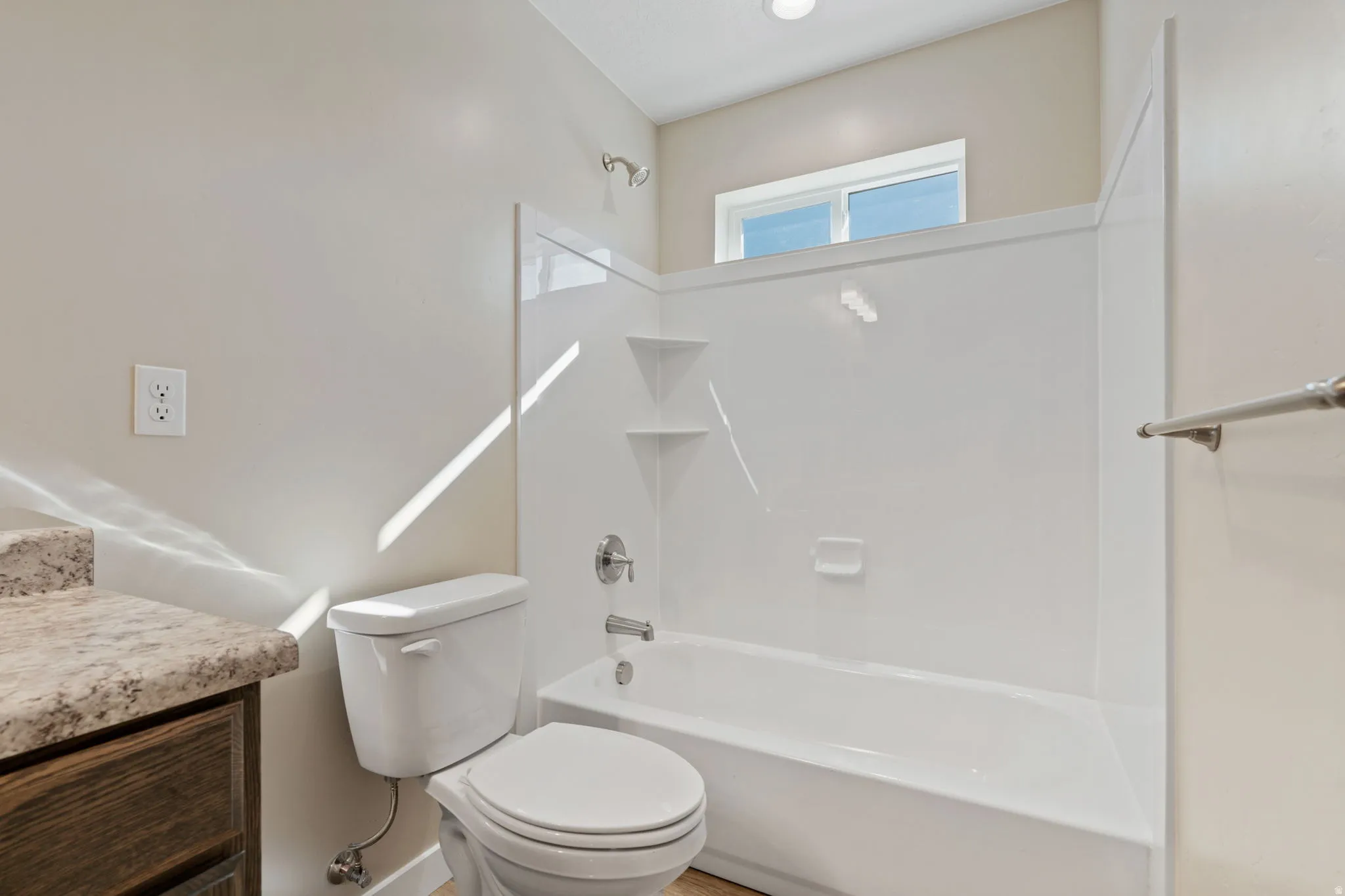 Bathroom with shower / washtub combination and vanity