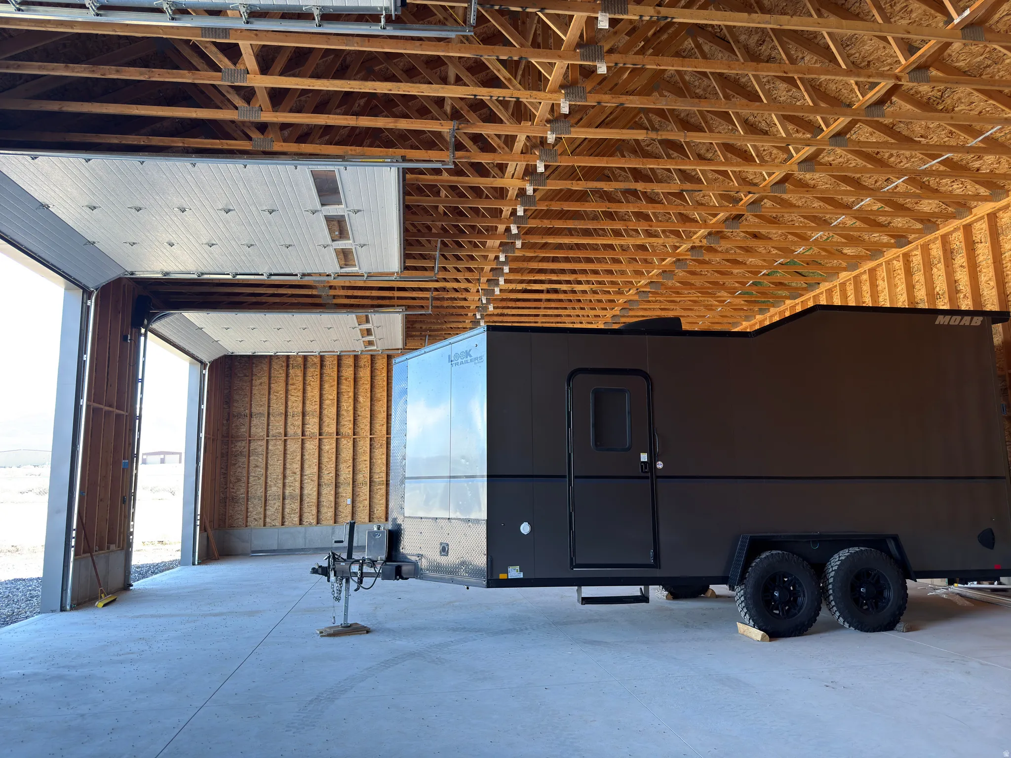 Miscellaneous room with unfinished concrete floors and healthy amount of natural light