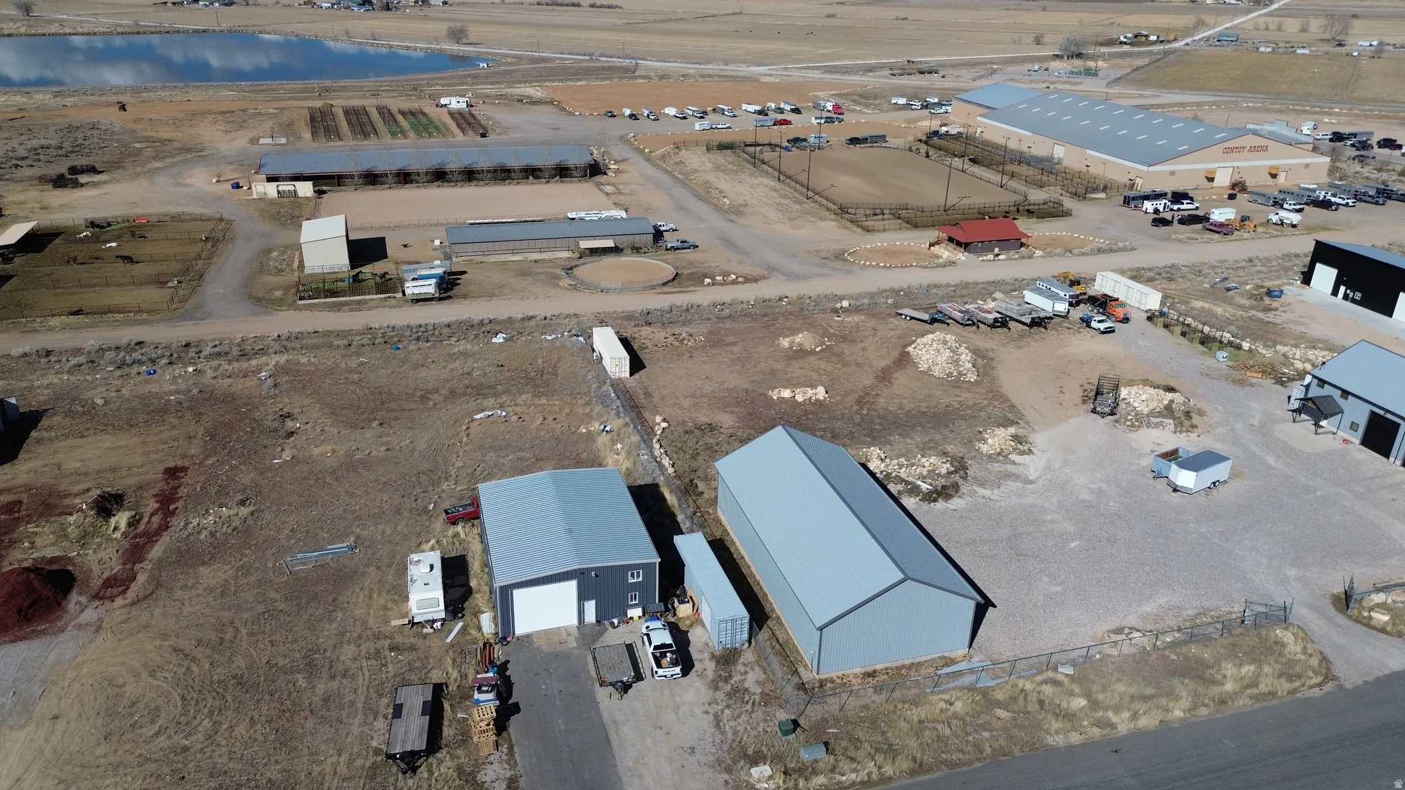 Aerial view of property and surrounding area with an industrial area