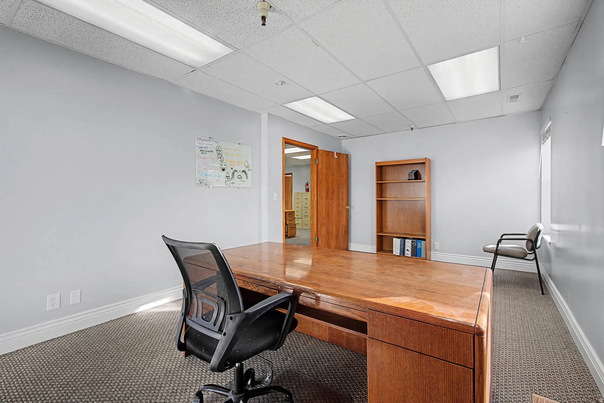 Home office featuring a drop ceiling