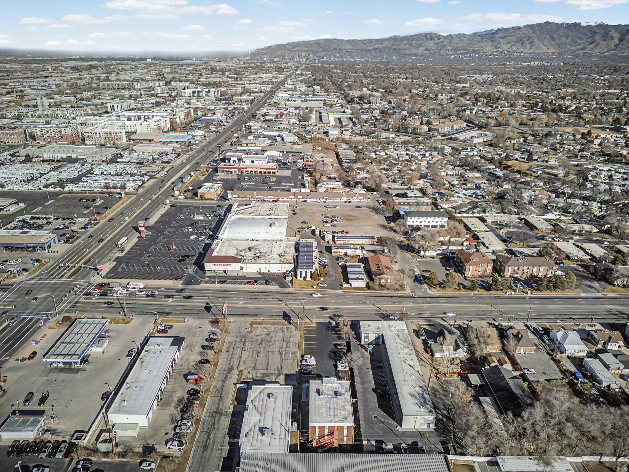 Aerial view of property and surrounding area featuring mountains
