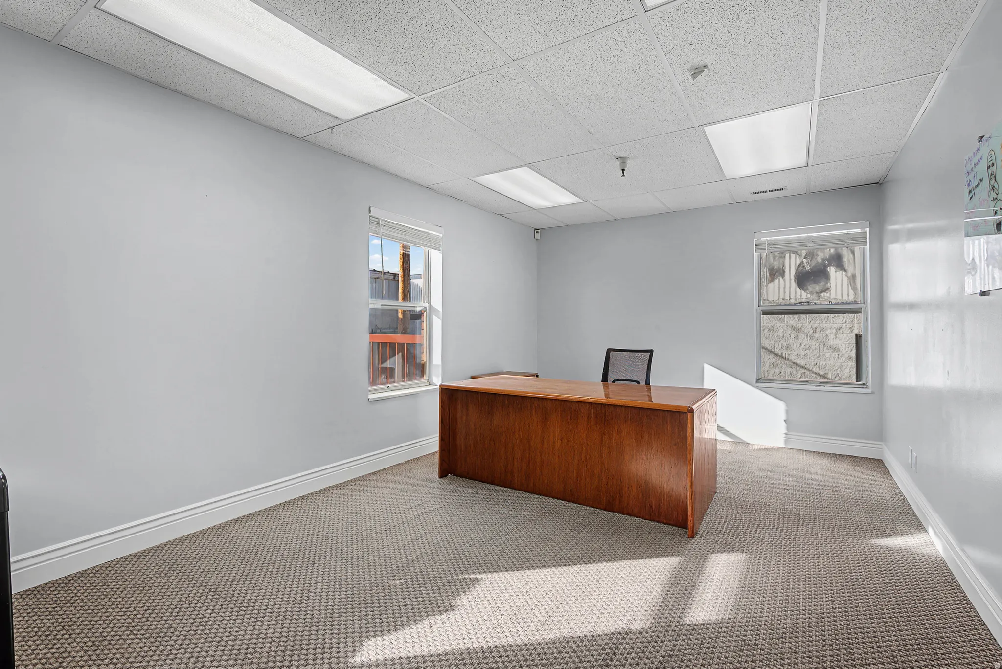 Home office featuring a drop ceiling