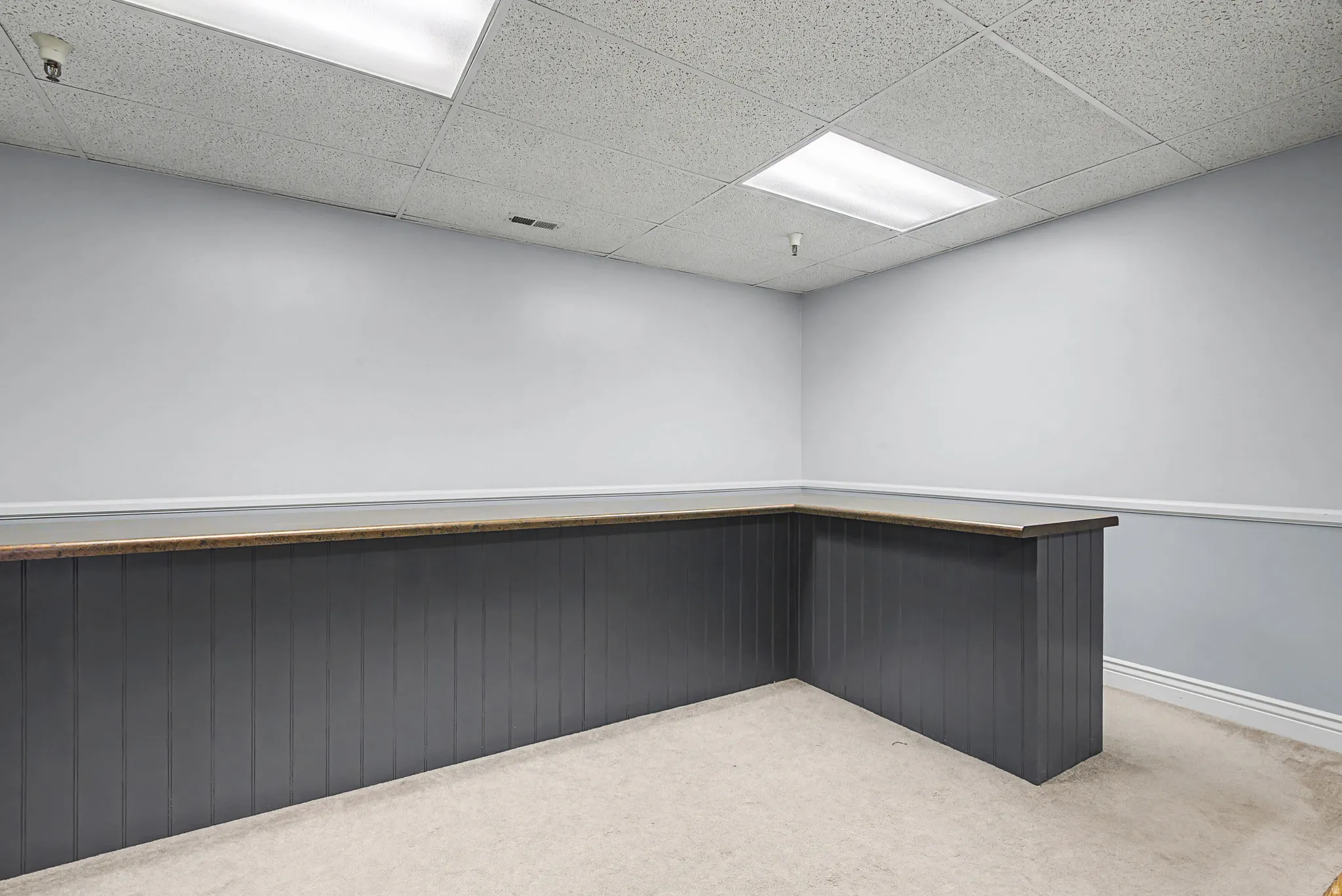 View of property's community with a drop ceiling