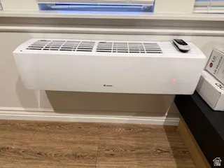 Detailed view of heating unit and wood finished floors