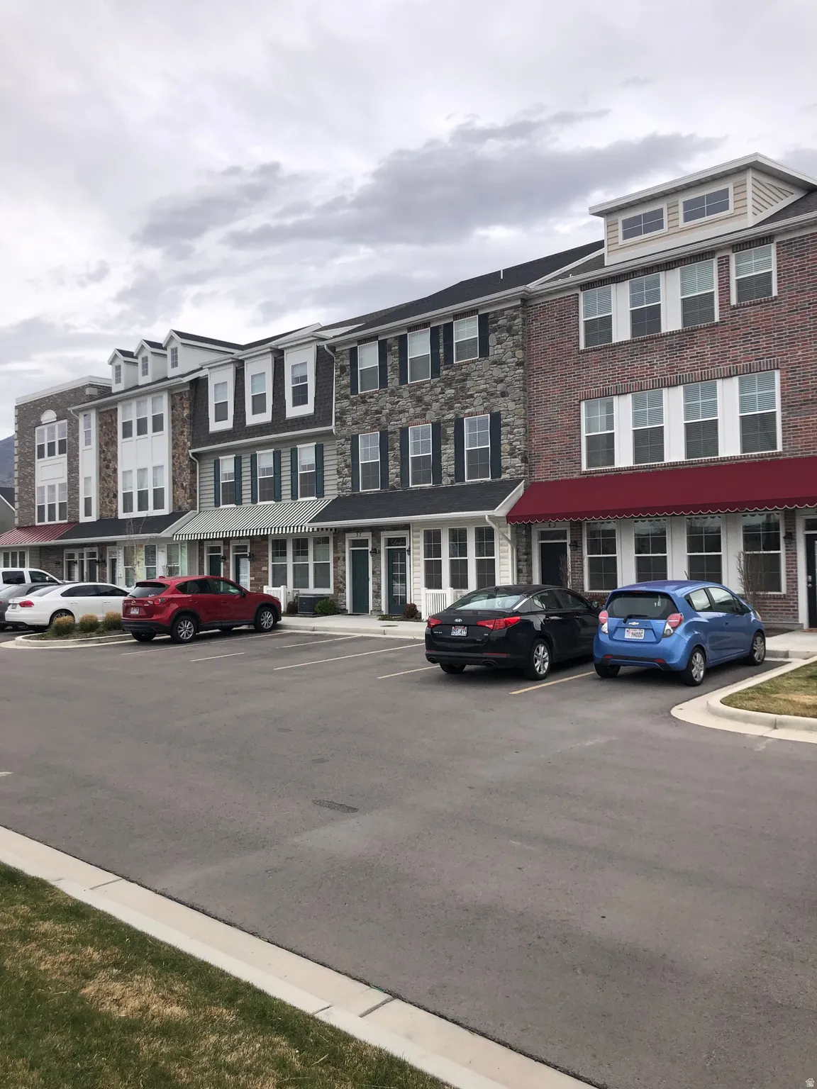 View of property featuring uncovered parking