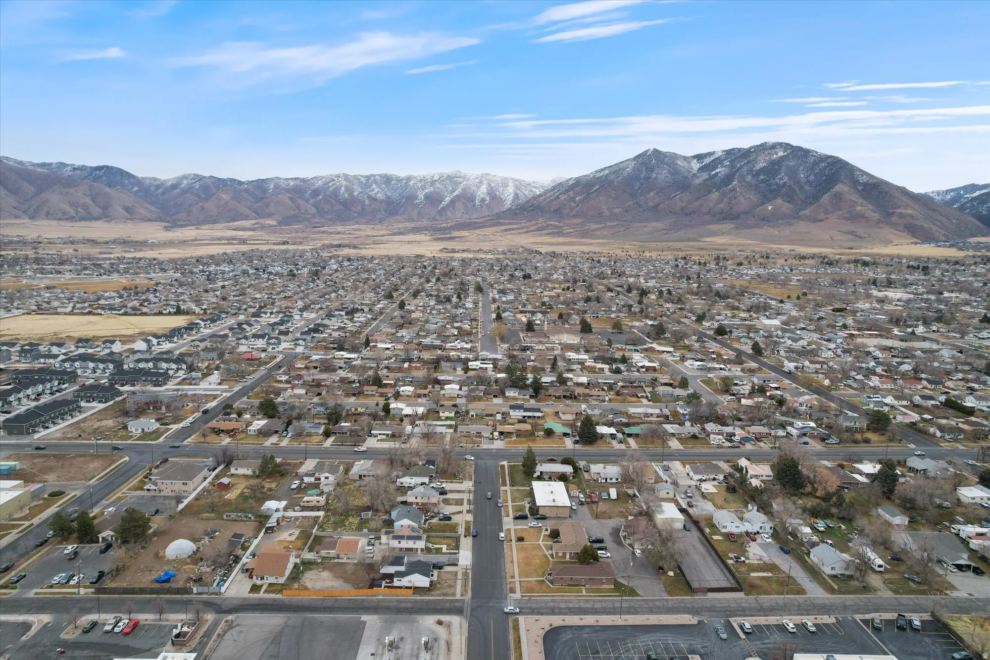 Aerial perspective of suburban area with a mountain backdrop