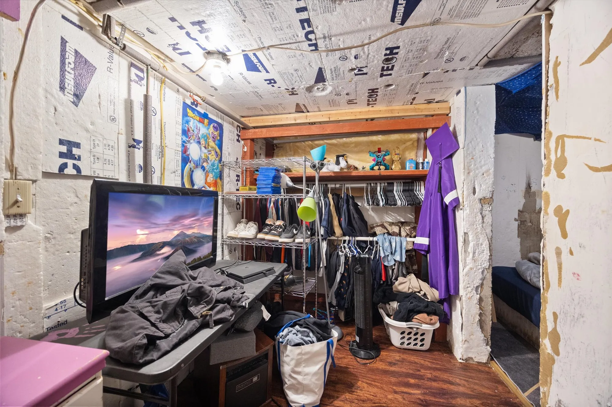 Bedroom with dark wood-type flooring