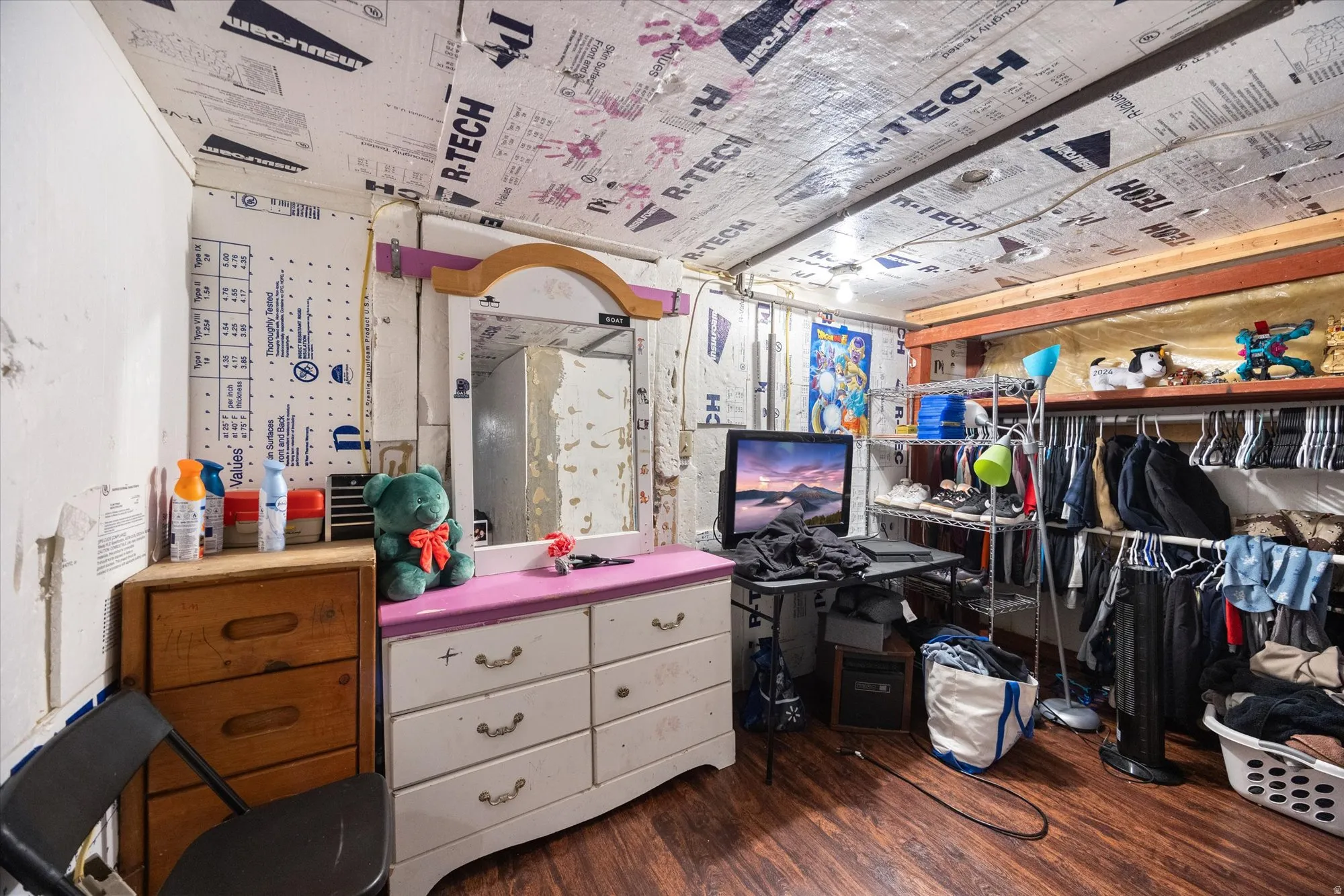 Miscellaneous room featuring dark wood-style floors