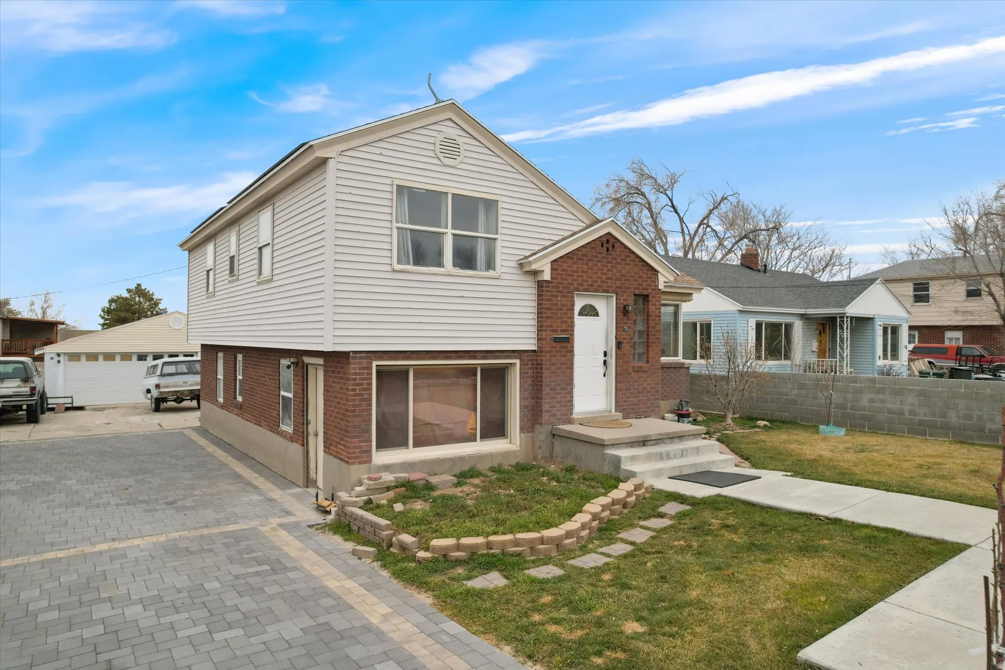 Split level home with brick siding