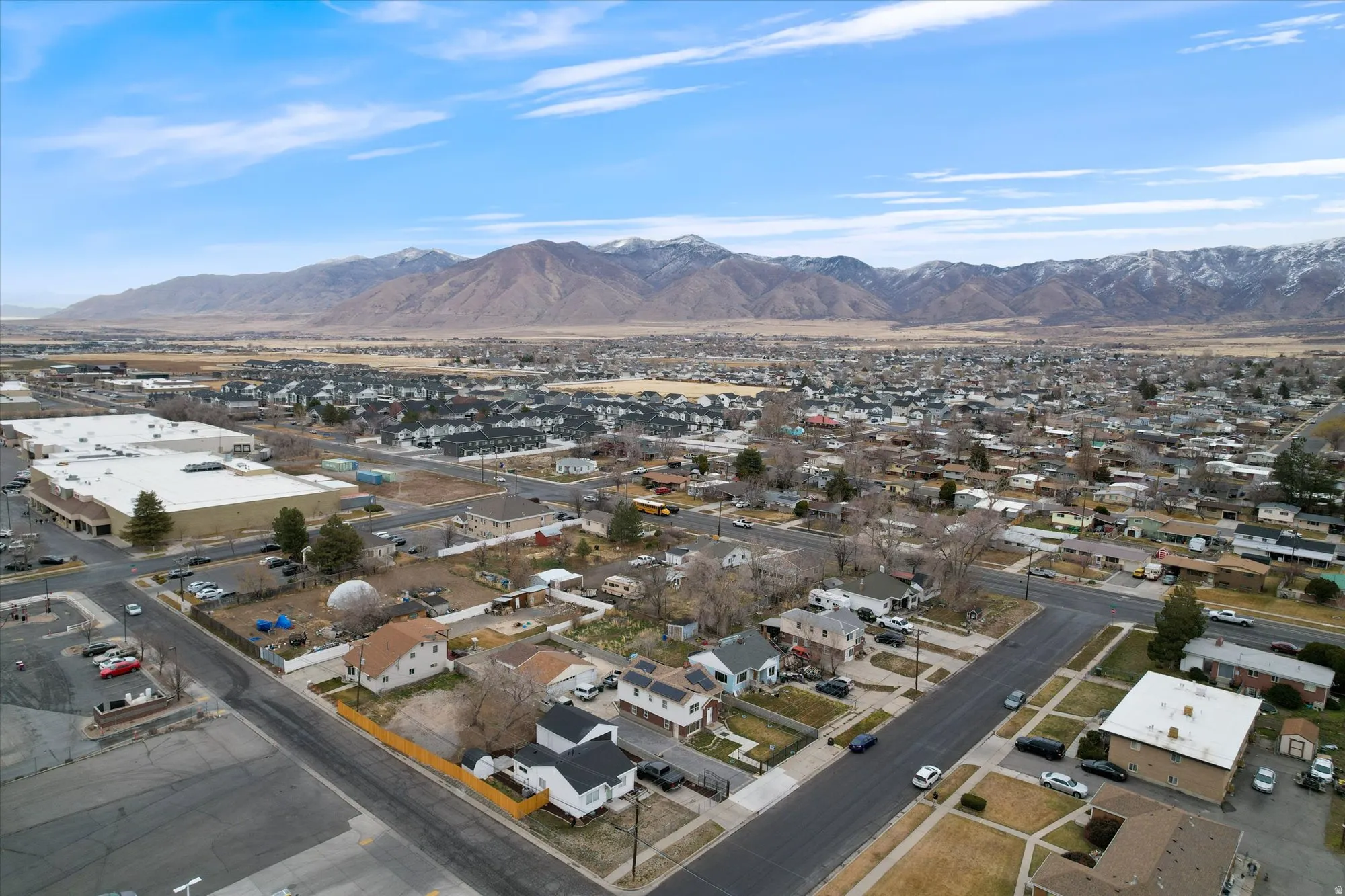 Aerial view of residential area with a mountain backdrop