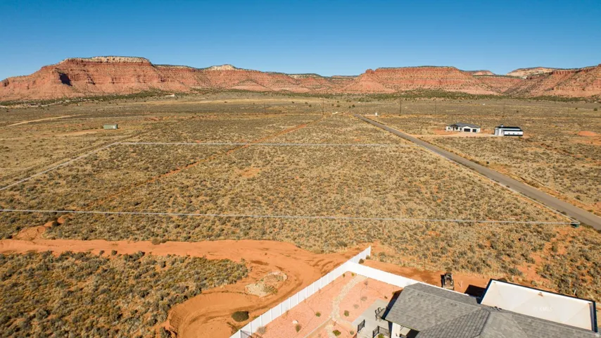 View of rural area featuring a mountainous background and a desert landscape