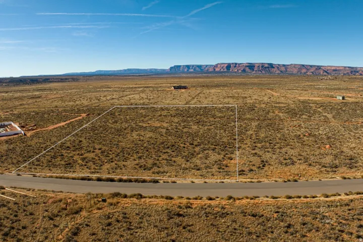 Overview of rural landscape with a mountain backdrop and a desert landscape