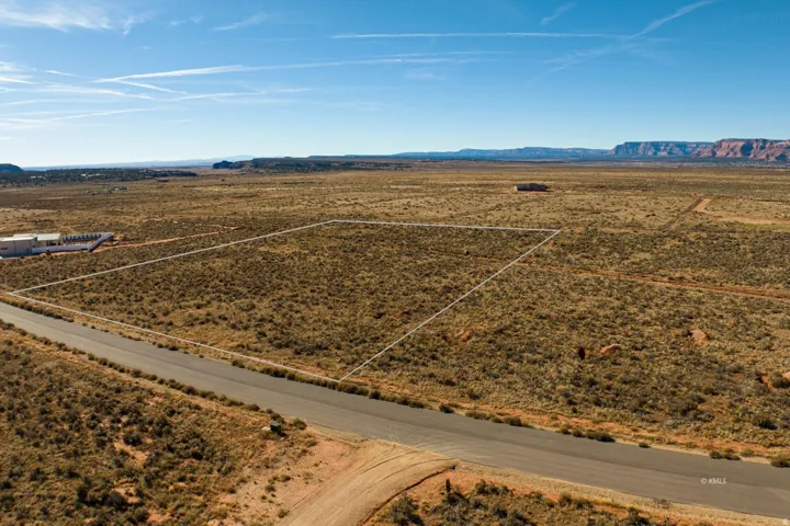 Aerial view of sparsely populated area featuring mountains and a desert landscape