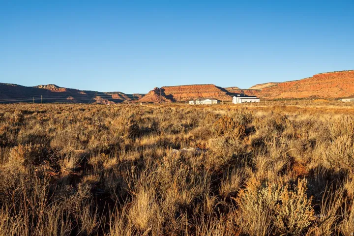 View of mountain backdrop featuring rural landscape