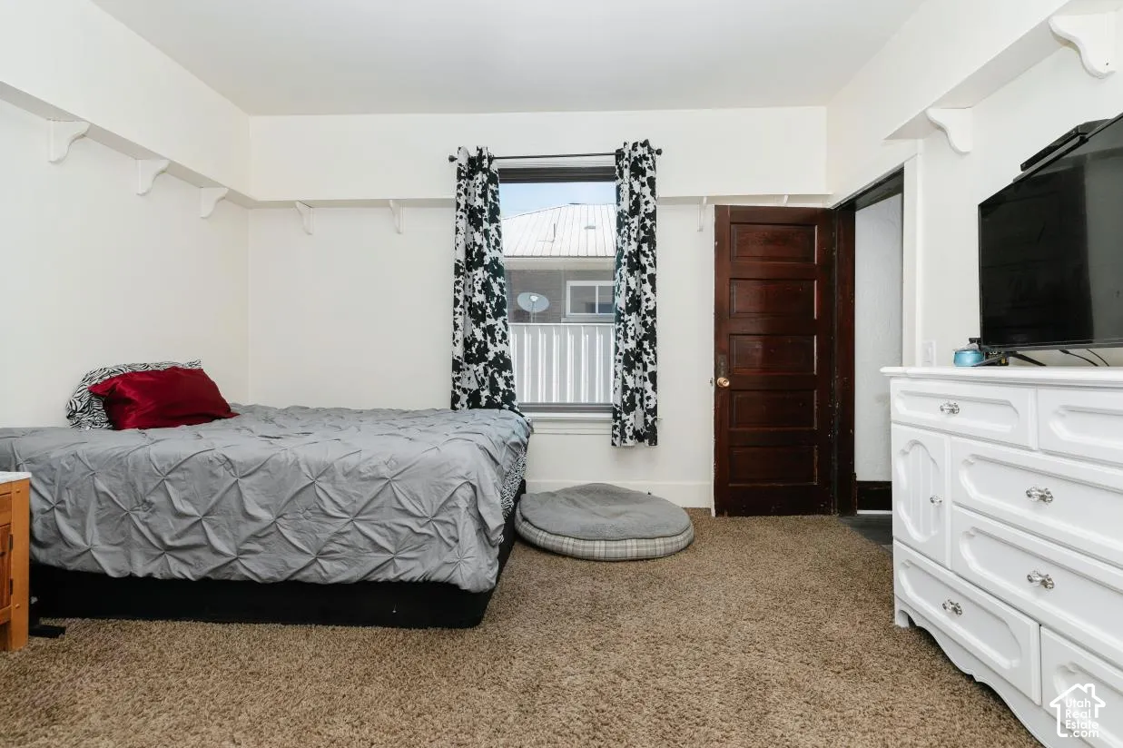 Bedroom with light carpet