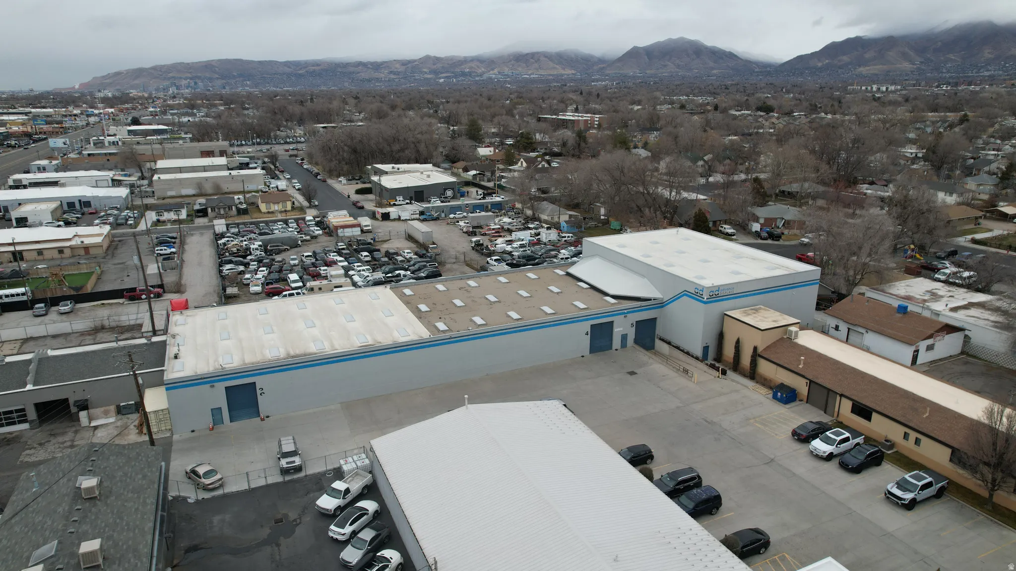 Bird's eye view of a mountain backdrop and industrial structures